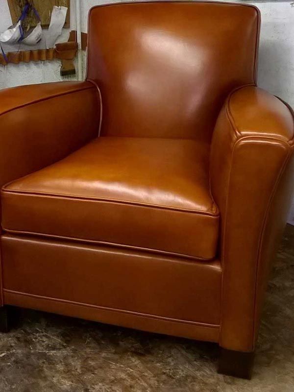Fauteuil club en cuir rénové